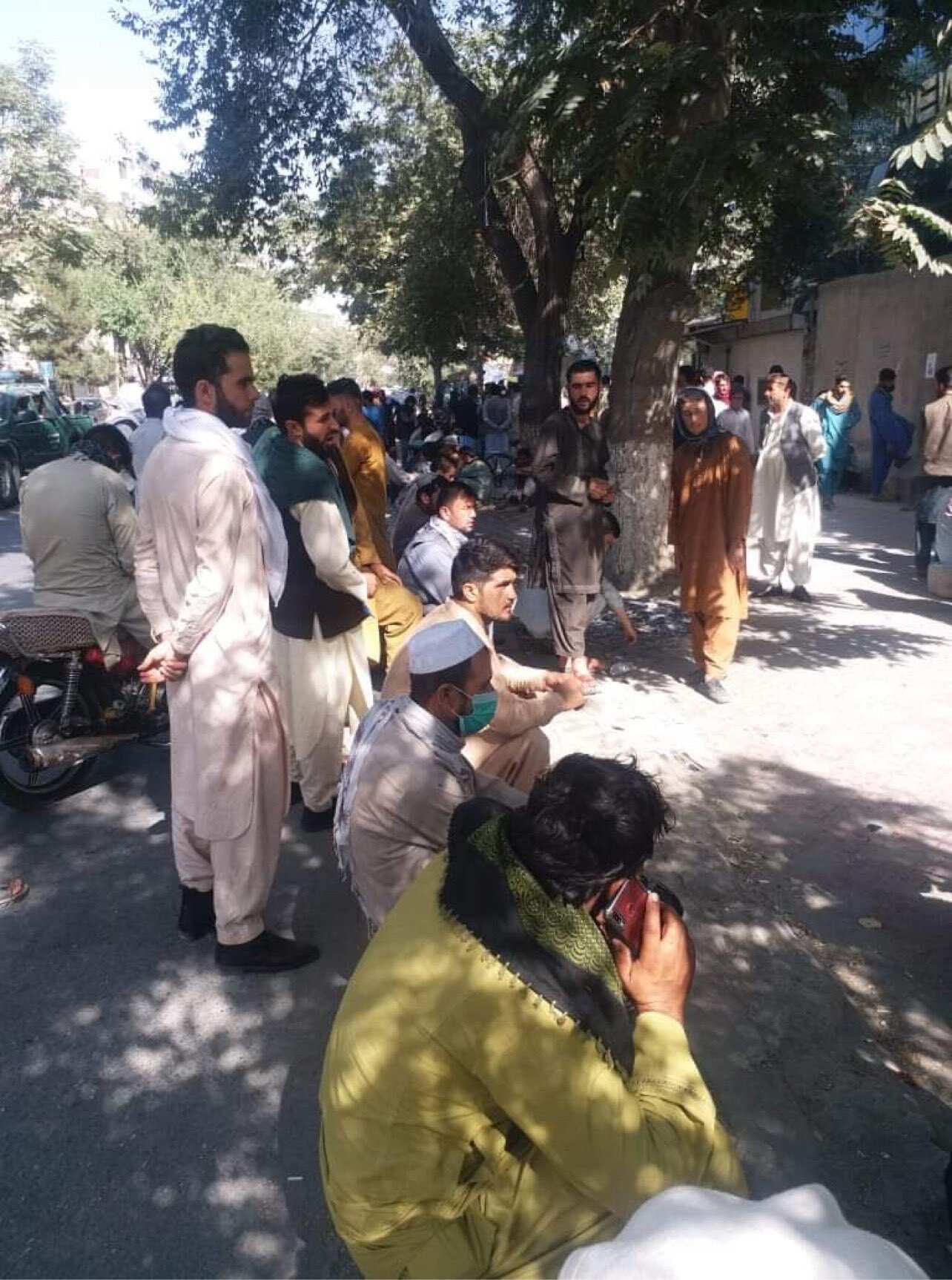 Large crowds seen waiting outside Kabul bank branch