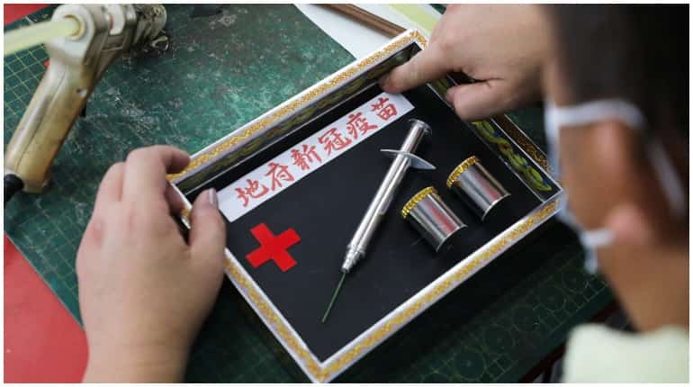 Malaysia: Covid vaccine paper mock-ups in demand during religious festival Malaysia: Covid vaccine paper mock-ups in demand during religious festival