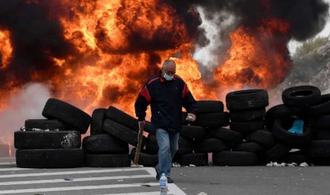 Rocks, bottles, firecrackers and burning tyres
