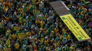 Pro-Bolsonaro protesters break down Brasilia police blockade