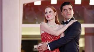 Jessica Chastain reacts to the viral video of Oscar Isaac kissing her arm on the red carpet
