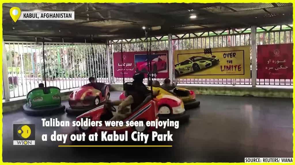 Taliban riding the dodgem cars at Kabul amusement park