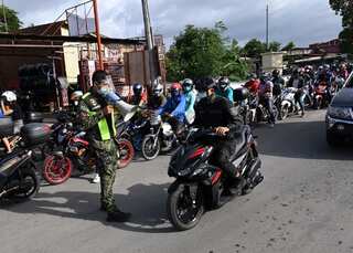 Philippines eases virus lockdown in capital to spur economy despite WHO warning
