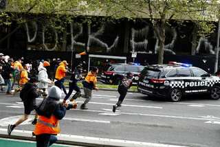 Melbourne anti-Covid vaccine protests turn violent as police fire pepper balls, smoke bombs