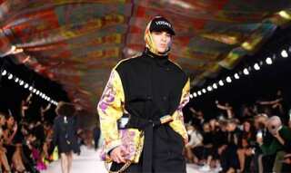 Prada strips dresses back, foulard inspires Versace in Milan