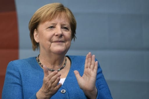 'Monument' Merkel gets standing ovation at last EU summit