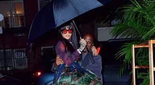 Pic: Rihanna's 'umbrella' moment is basically life imitating art