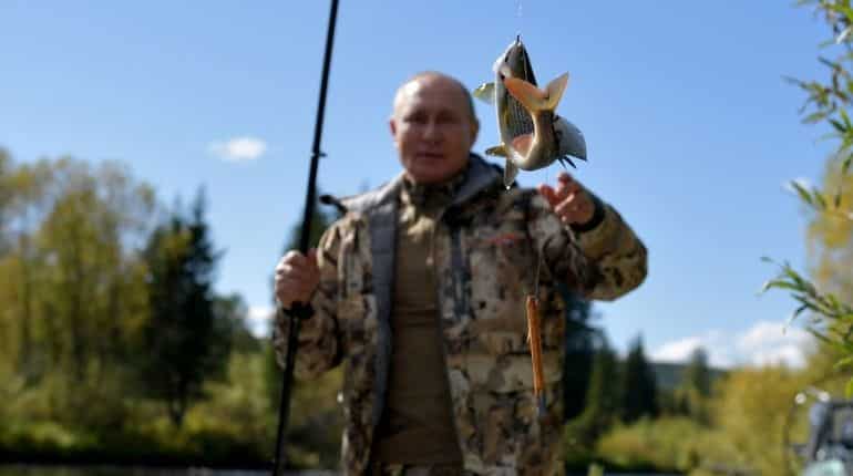 Kremlin releases photos of Vladimir Putin hiking and fishing in Siberia