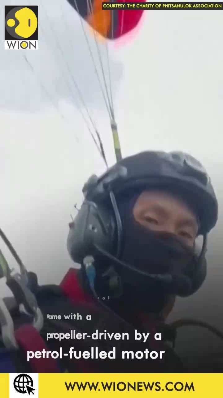 Thai paramotorists drop supplies to flood affected areas