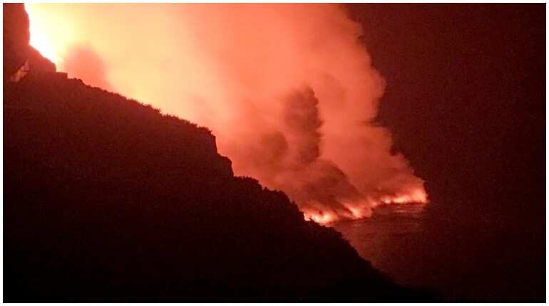 Canaries volcano lava reaches sea, raising toxic gas fears