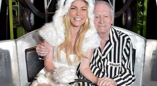 Playboy founder Hugh Hefner's wife defends him against criticism from exes
