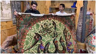 Craftsman uses calligraphy on Kashmiri silk carpets, demand increases