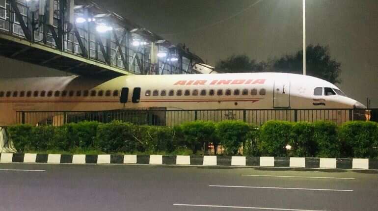 Watch: Scrapped Air India plane gets stuck under a foot-over bridge in Delhi Watch: Scrapped Air India plane gets stuck under a foot-over bridge in Delhi
