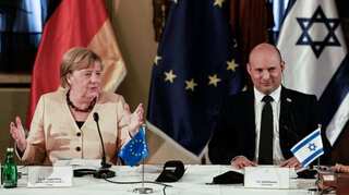 Honouring genocide victims, Merkel vows German support to Israel's security