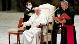 Boy steals the show by trying to take Pope's skull cap