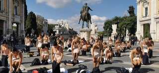 Former Alitalia flight attendants strip down in protest against ITA airways