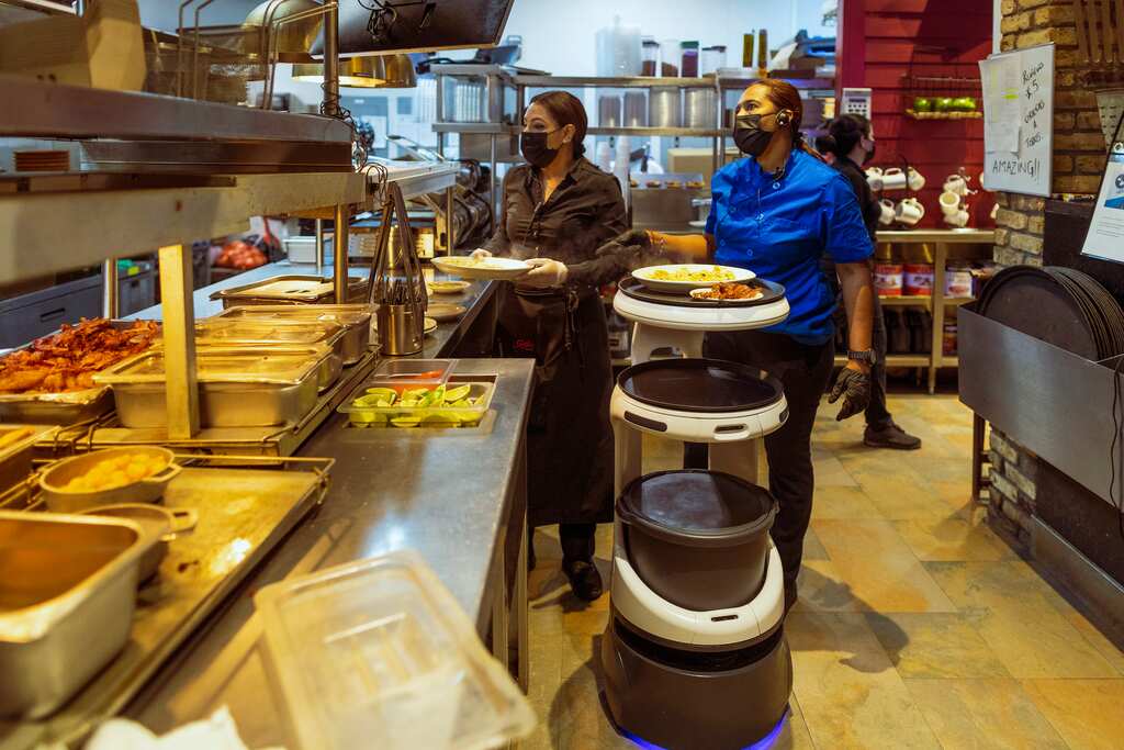 Desperate for workers, restaurants turn to robots