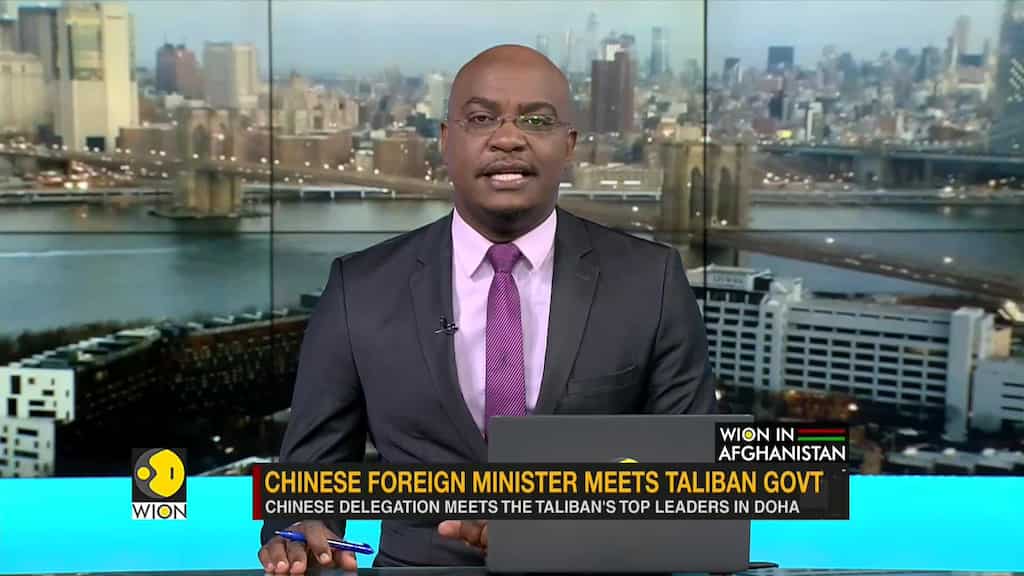 Chinese FM Wang Yi meets the Taliban's top leader Mullah Baradar in Doha