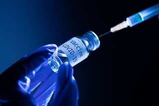 Amid Covid surge, UK to send booster shot invite a month early