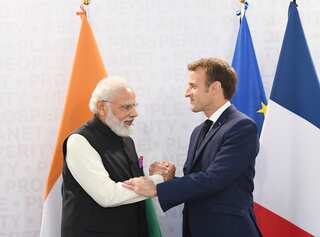 PM Modi interacts with French President Macron on the sidelines of G20