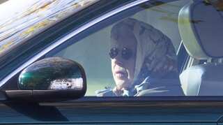 Going for a spin? Queen boards vehicle to go for drive around Windsor estate