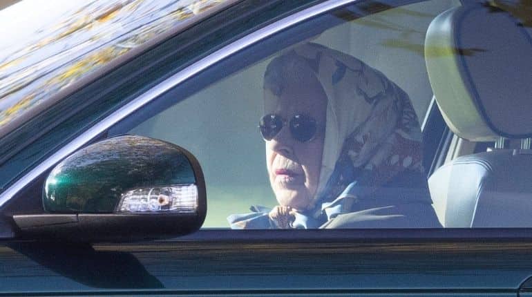 Going for a spin? Queen boards vehicle to go for drive around Windsor estate