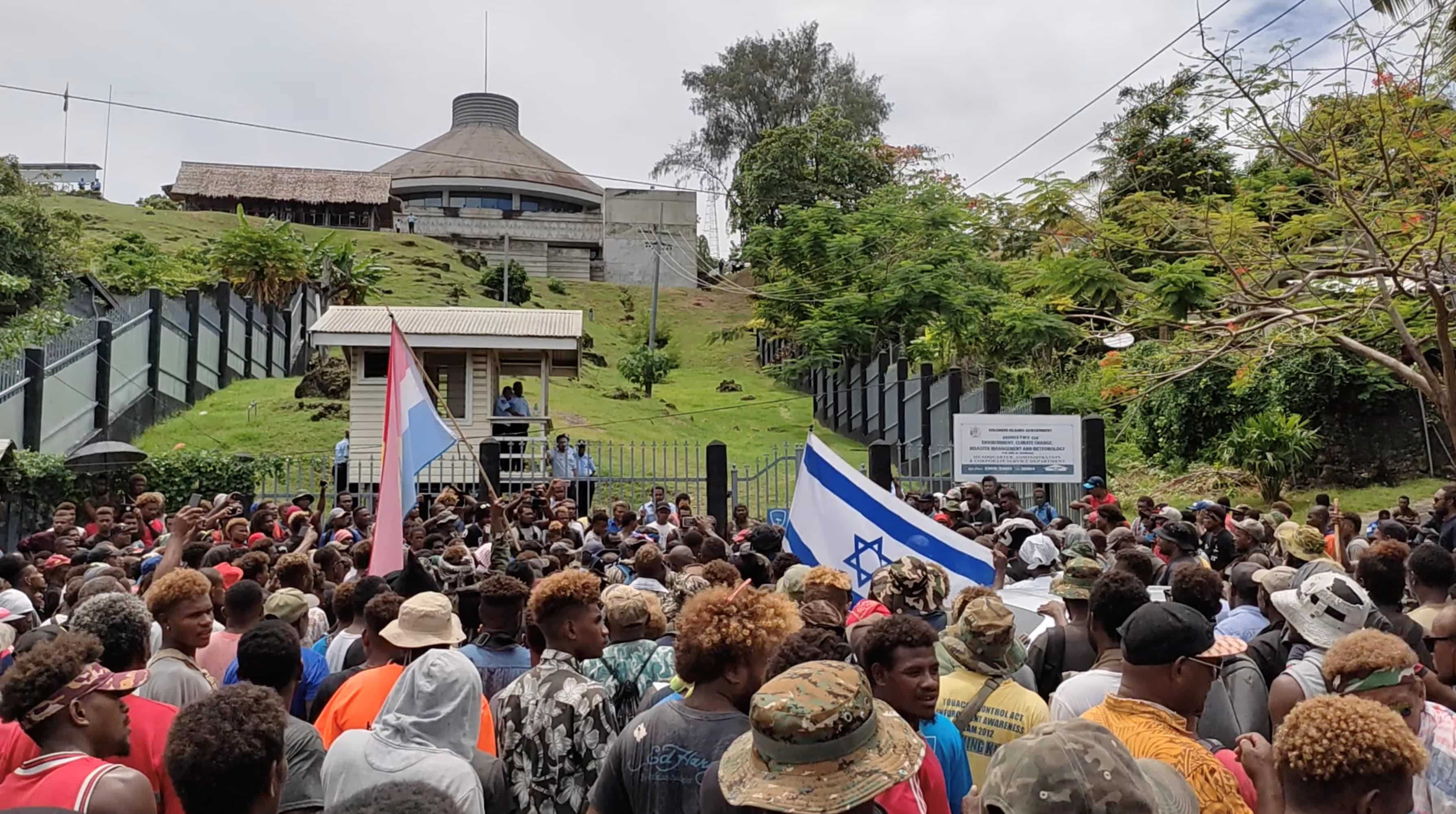 Protesters burn down parliament building, police station in Solomon Islands