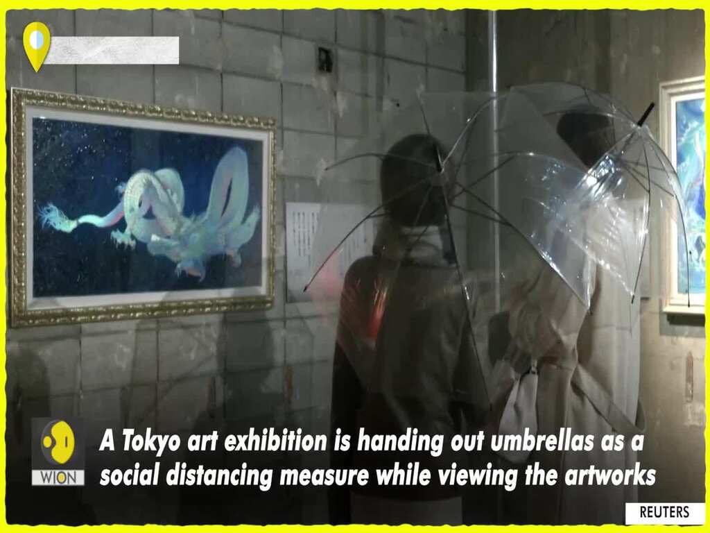 Tokyo art exhibition hands out umbrellas as social distancing measure