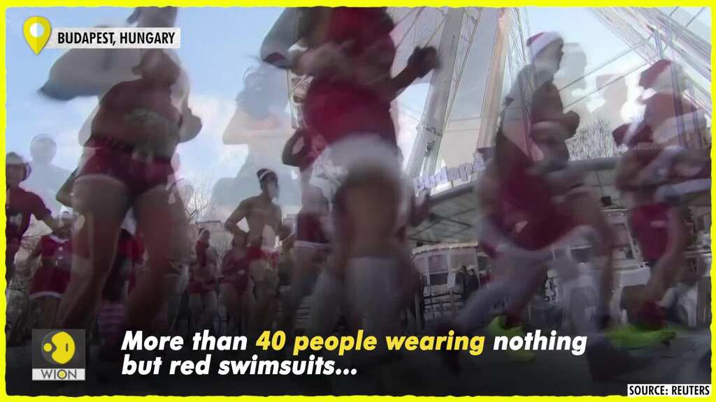 Half-naked Hungarians wearing only Santa swimsuits run for charity