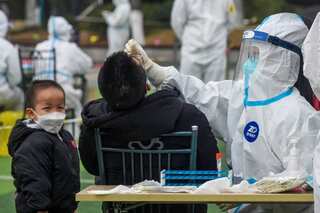 China records second Omicron case; virus surge in major export hub