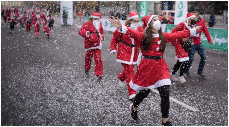 Madrid: Thousands dressed as Santa take part in charity run for volcano-hit La Palma