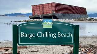Stuck on a beach, hulking barge turns unlikely celebrity in Canada
