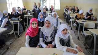 China is on a school-building spree in Iraq. Over 1,000 by two firms