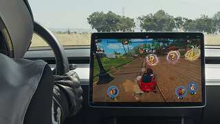 US initiates probe into Tesla letting people play video games while driving