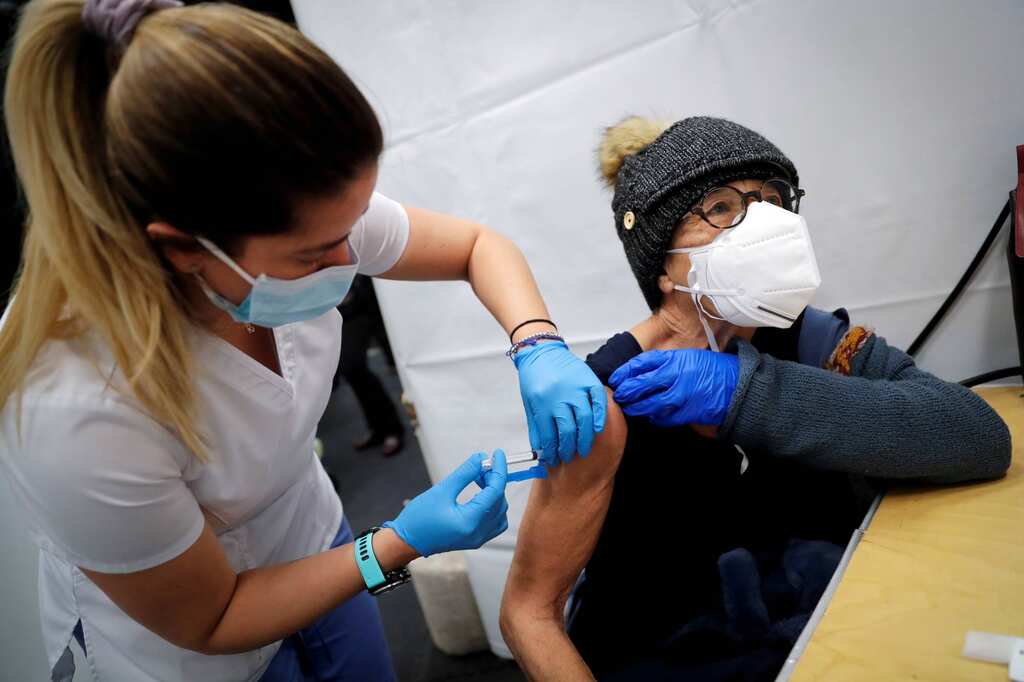 COVID-19 vaccination mandatory in Singapore for pass approvals from February 2022