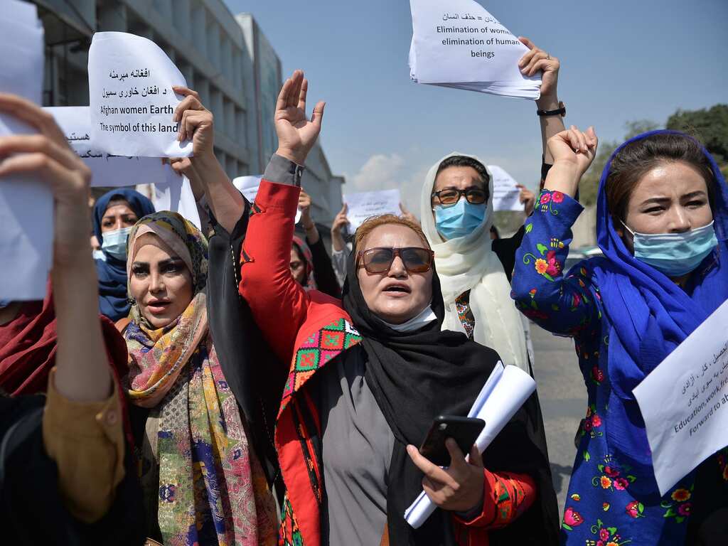 Afghan women protest in a closed area in Kabul demanding rights