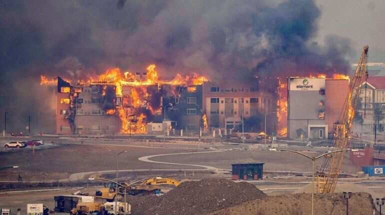 Numerous homes lost, tens of thousands evacuated as wildfires cause havoc in US