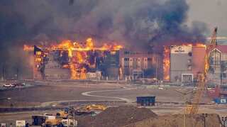 Numerous homes lost, tens of thousands evacuated as wildfires cause havoc in US