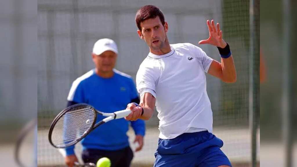 Novak Djokovic trains at Australian open venue as participation hangs in balance