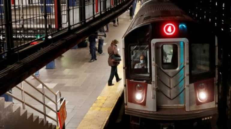 Woman dies after being shoved in front of subway train at Times Square ...