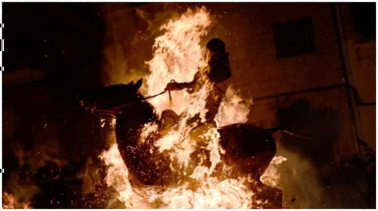 Horses jump through fire as Spanish festival makes a comeback Horses jump through fire as Spanish festival makes a comeback