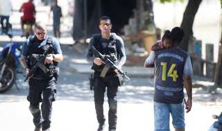 Rio de Janeiro police occupy favelas in new push to combat gangs
