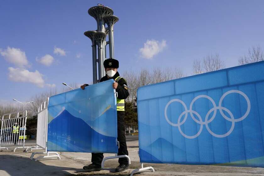 Inside Beijing’s Olympic Bubble: Robots, cocktails and Hazmat suits