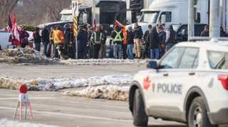 As trucker protests intensify, Canada's provinces move to ease Covid rules