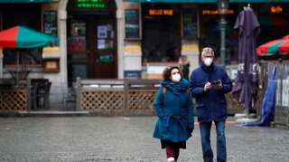 Belgium to reopen nightclubs, ease mask mandate as infections sink