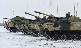 Russia 'pulling back more troops' but US says Moscow could launch 'false' pretext to invade Ukraine