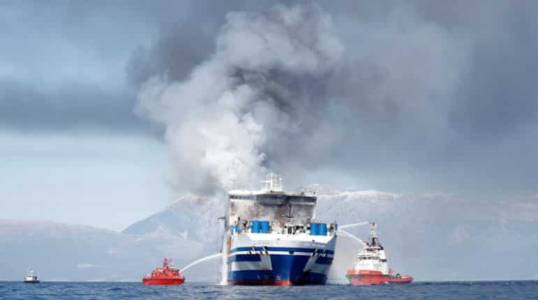 Passenger found alive on Greece-Italy ferry after blaze, 11 still missing
