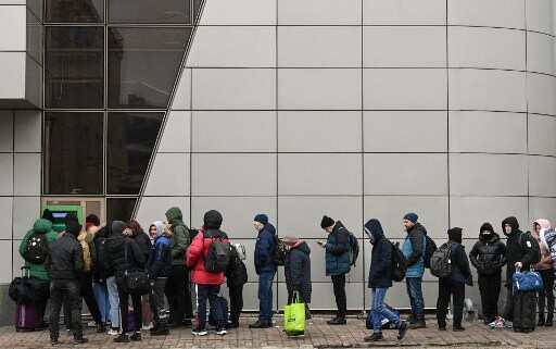 People line up to withdraw money