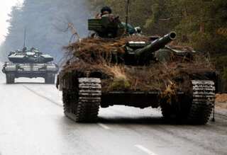 Watch: ‘Lost’ Russian tanks forced to retreat after surrounded by hundreds of Ukraine civilians