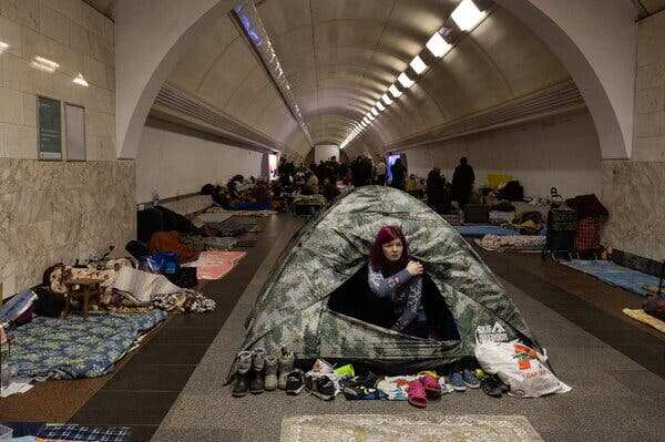 Life in Kyiv moves underground as a 40-mile-long armed Russian convoy encircles Kyiv